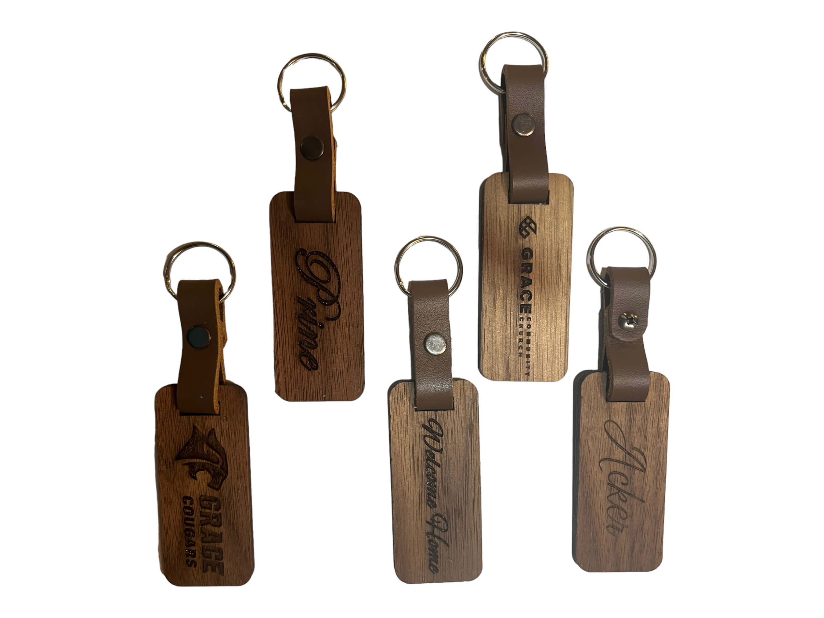 vertical image of the walnut keyrings. Get any inscription you need on these. Makes wonderful gifts. SawyerCustomCrafts.com