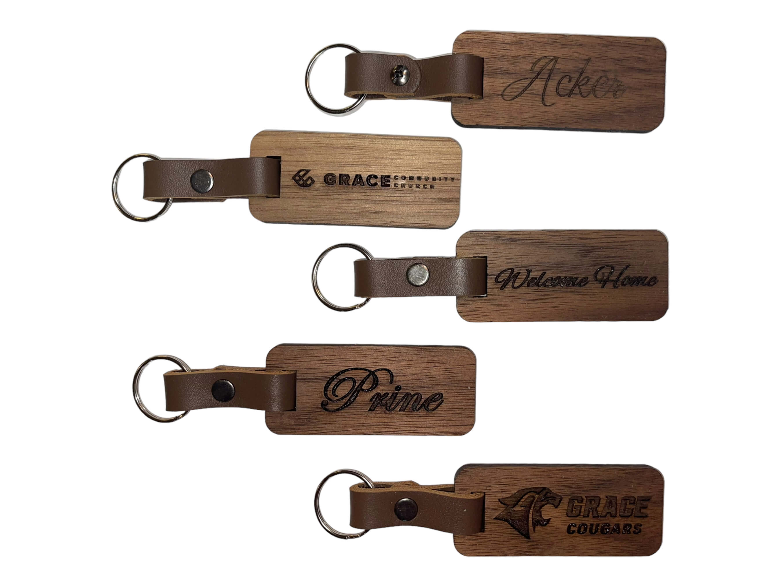 Beautiful image showing some of the design ideas for our walnut keyrings. SawyerCustomCrafts.com