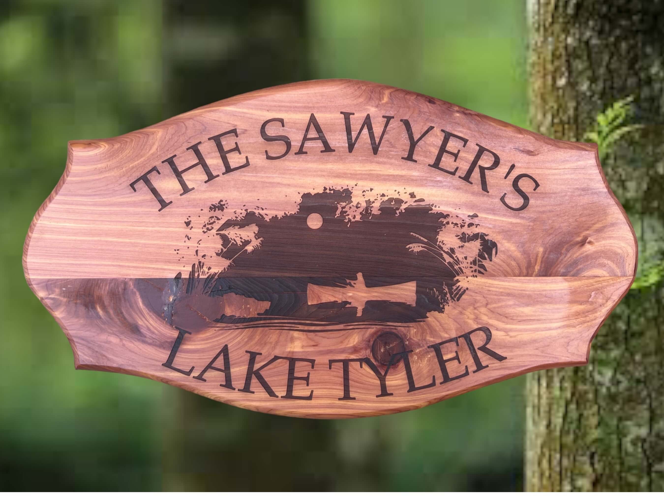 "Handmade Cedar Lake House Plaque with Personalization" Description: A handmade cedar plaque designed for lake house enthusiasts. The center of the sign depicts a laser-engraved image of a man fishing in a small boat. Customize it with your last name and lake name.