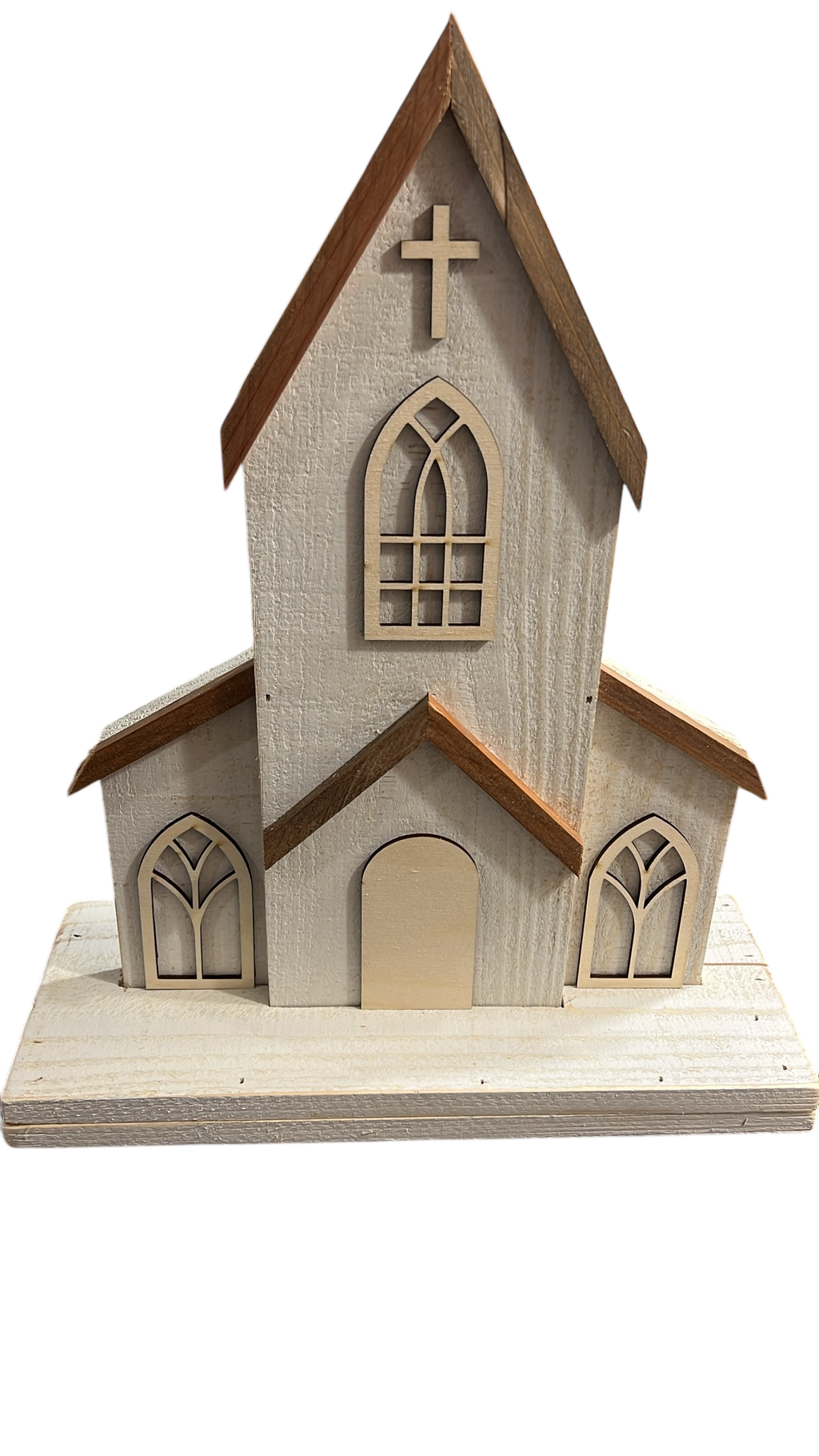 Close-up of handmade two-piece wooden church decor with engraved door option, distressed white finish, and natural cedar roof. Features arched windows and a wooden cross, perfect for rustic farmhouse or faith-inspired home decoration.