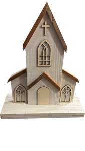Close-up of handmade two-piece wooden church decor with engraved door option, distressed white finish, and natural cedar roof. Features arched windows and a wooden cross, perfect for rustic farmhouse or faith-inspired home decoration.