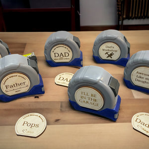 Photo shows some of the many design options that are available for our personalizable Father's day tape measures. Which Design do you like best?