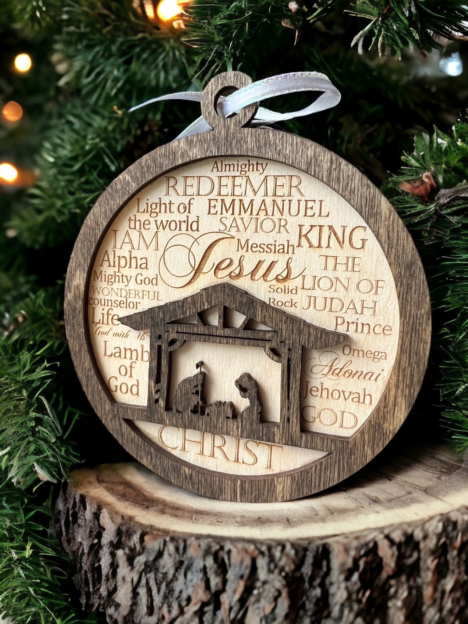 Christian Jesus Ornament or stocking label shown here with the names of God encircled around the birth of Jesus at the manger. awyerCustomCrafts.Com