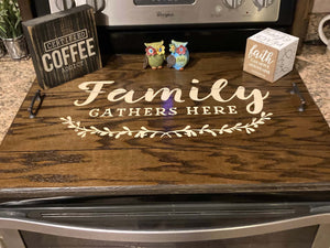 Modern Farmhouse Stovetop Cover stained in Dark walnut with cream words which say "Family Gathers Here". See more at Sawyercustomcrafts.com